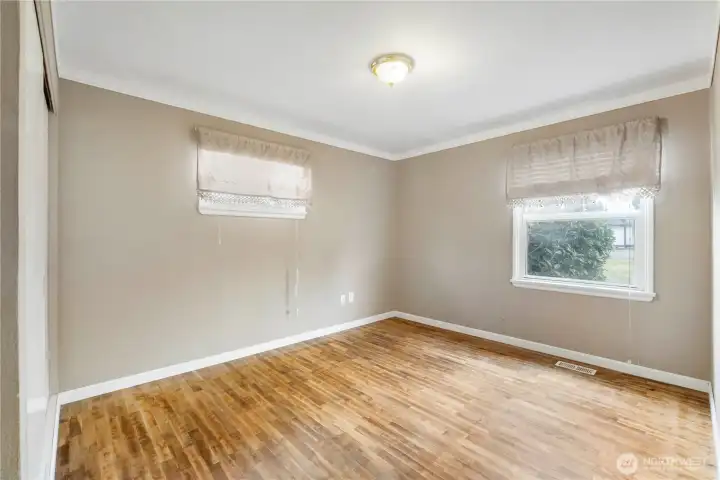 2nd Bedroom with hardwood flooring & looking out to the front yard