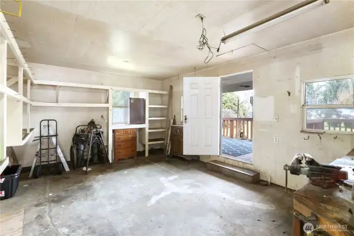 ntrance door on the right leading into previous shop for an iron worker. Yes, small frig stays with the home. More items still to be removed from shop