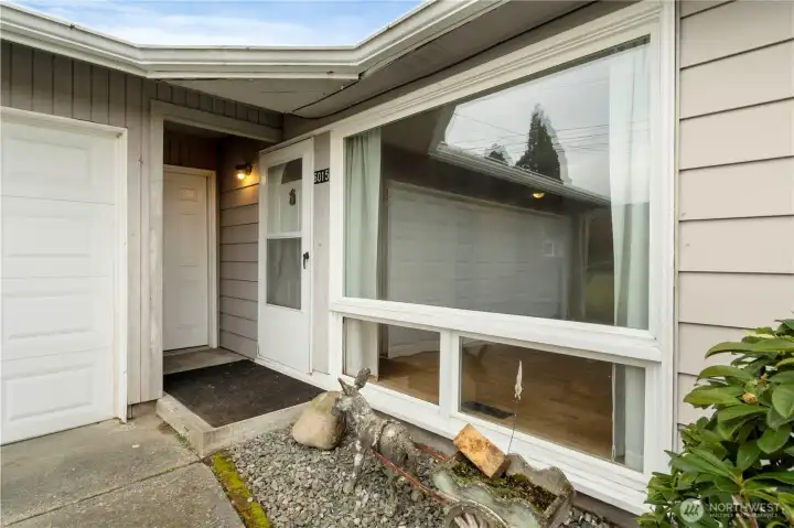 Welcome home! Door on the left comes out of large garage & leads to front door in the middle. Little donkey historically has worn different outfits celebrating different times of the year