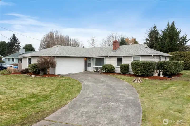 Looking down the curving driveway leading to home