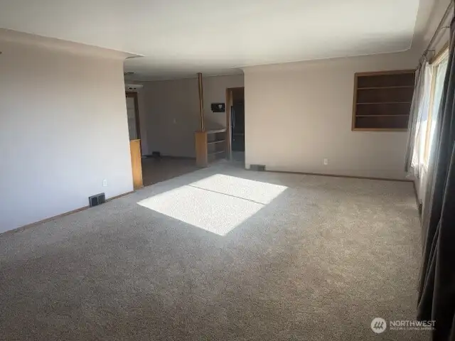 Living room from front door looking to dining and kitchen Living room from front door looking to dining and kitchen