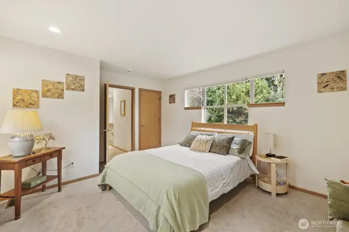 This second upstairs bedroom is so bright, airy and spacious!
