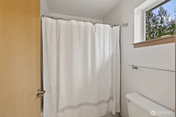 The upstairs hall bathroom is nicely divided for privacy. Works great if two people need to get ready at the same time.