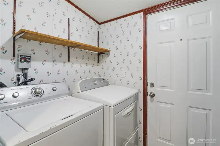 Laundry room, located just off kitchen with access to the side porch and yard.