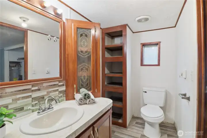 Main bathroom with additional storage.