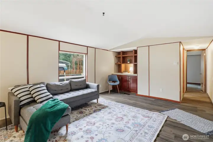 Living room with storage in the corner.