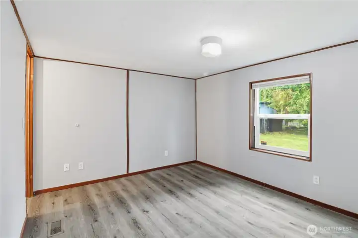 Second bedroom, looking to the front of the property.