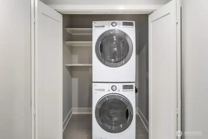 Utility Room with Selves and Full-Size Washer and Dryer