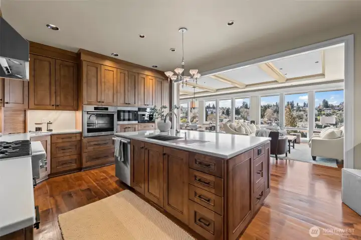 The boundaries between culinary art and relaxation dissolve. This vantage point illustrates the home’s thoughtful orientation, where every culinary endeavor is backdropped by the serene beauty of the Sound and the town's historic skyline.