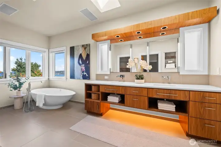 Luxury is in the details. The integrated vanity lighting and sophisticated free-standing tub adds a layer of contemporary depth to the suite, creating a serene ambiance that rivals the finest five-star resorts.