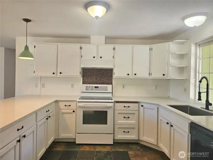 Beautiful new quartz counters. Slate floor. Beautiful new quartz counters. Slate floor.