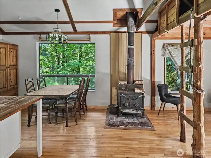 Stepping through the front door, you enter the living and kitchen space. Wood stoves are featured in each of the four structures, but this is the only one currently connected to electricity and water.