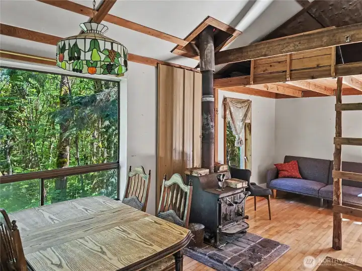 Dining and living space with a loft above for storage or sleeping.