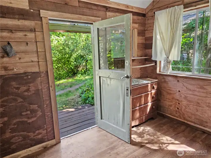 Also featuring a wood stove, this cabin gets plenty of light! It would be easy to connect electricity to this space.