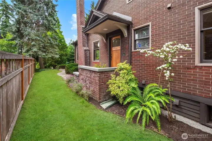 Outside, enjoy a private backyard retreat surrounded by mature landscaping, offering room to relax, garden, or entertain.