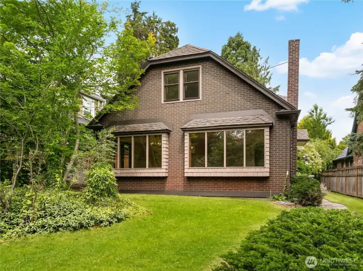 Nestled on a tree-lined street, this timeless Tudor in Magnolia blends classic character with generous living spaces and exceptional natural light. Perfectly positioned with coveted southern exposure, the home is filled with sunshine throughout the day, highlighting its rich architectural details, warm hardwood floors, and inviting living spaces.