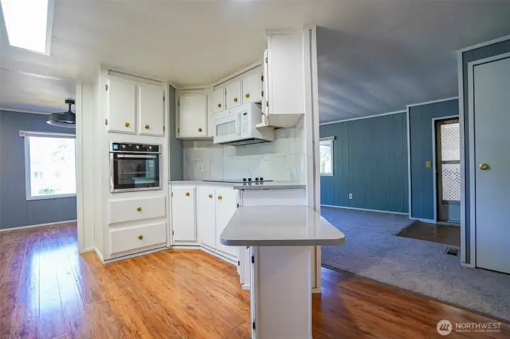 Kitchen and walkway to living room.