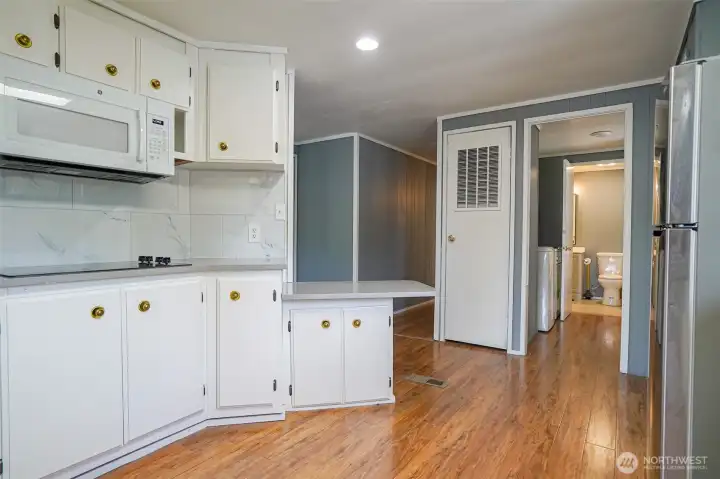 Kitchen and walkway to laundry, bathroom and back door.