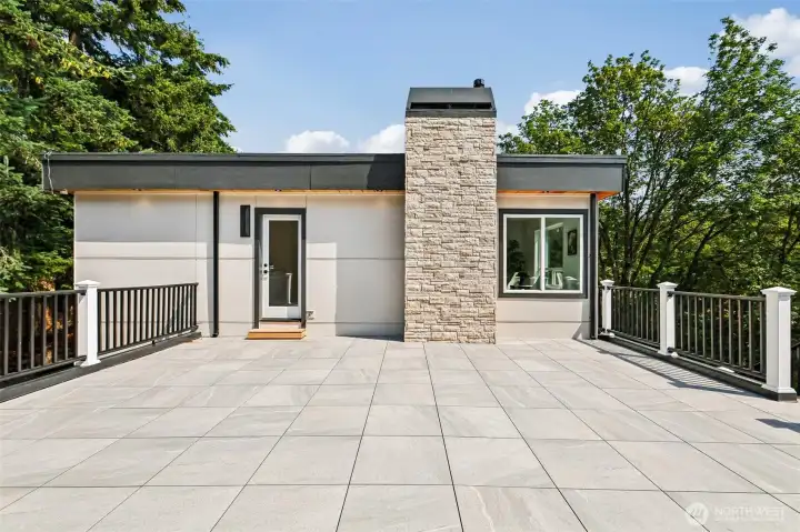 The expansive terrace above the garage creates an impressive outdoor entertaining space.