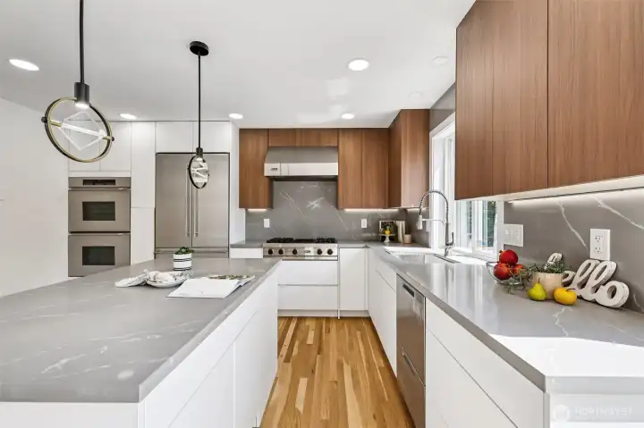 The large kitchen island provides generous workspace and storage.