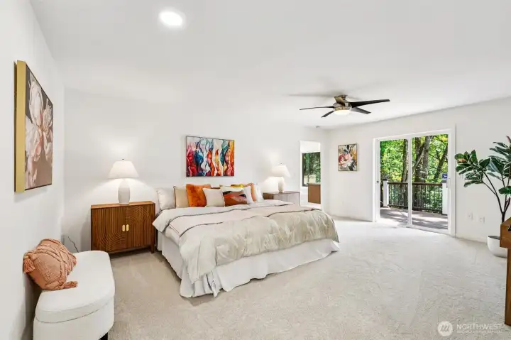 The spacious primary suite includes private deck access and room for a relaxing sitting area.