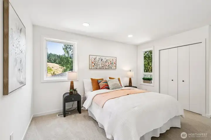 An additional upstairs bedroom offers a comfortable layout, bright windows and generous storage.