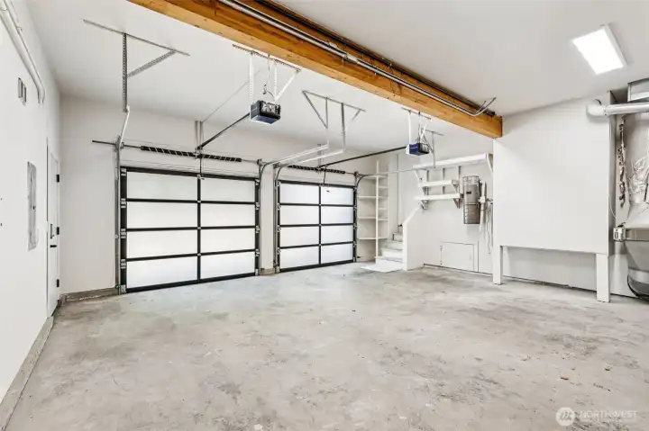 The two-car garage provides parking, built-in storage and additional workspace.