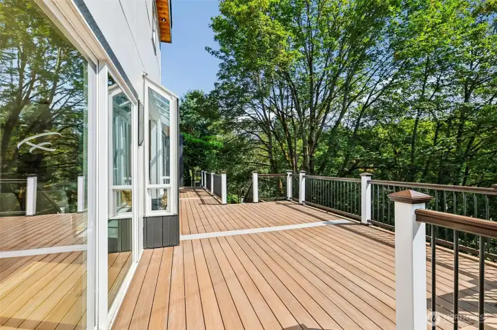 The main deck extends directly from the living and dining areas for effortless indoor-outdoor living.