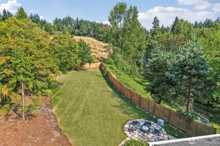 An aerial perspective highlights the scale of the large, usable and partially fenced yard.