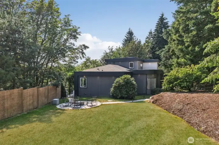 The backyard offers a firepit patio, expansive lawn and privacy from mature landscaping.