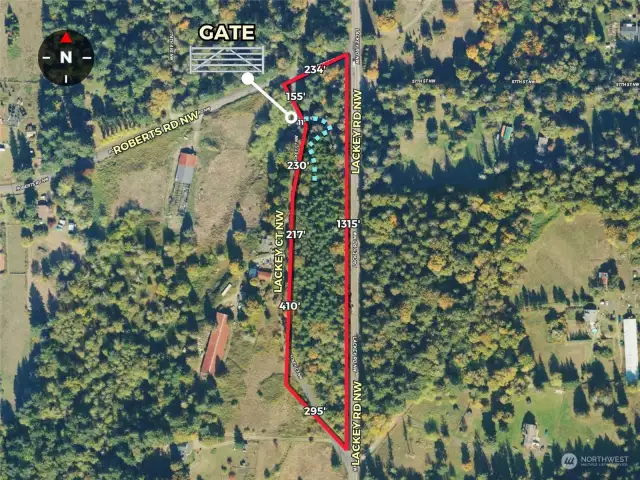 Approximate boundaries in red with approximate dimensions along with location of gate and driveway.