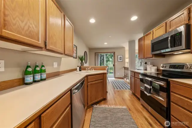 Kitchen with breakfast bar and eating area