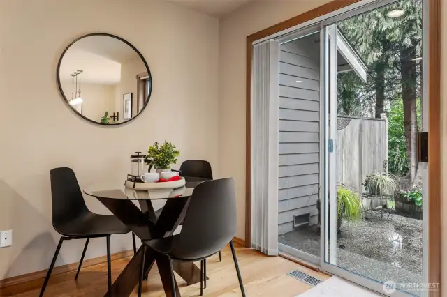 Eating area with slider to patio, yard and greenbelt