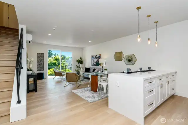 Entertain in style with this oversized waterfall island, offering ample storage and a stunning centerpiece for gatherings.