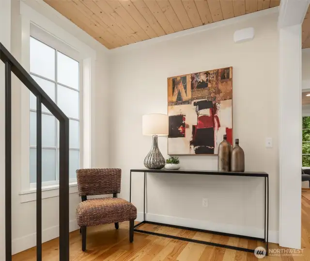 Upstairs at the 2nd level landing, one is greeted by custom milled, solid wood floors, generous, light filled spaces, extensive millwork trim and warm paneled ceilings.  Floors are milled from the wood deconstructed from St. George Episcopal Church, which stood previously on the property since 1959.