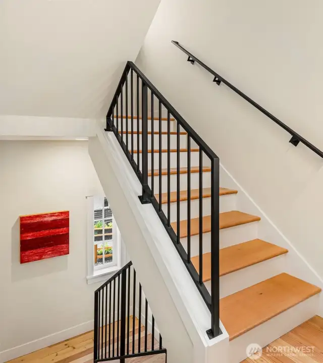 The gracious spaces are filled with light and trimmed with many custom details including custom ornamental metal railings.