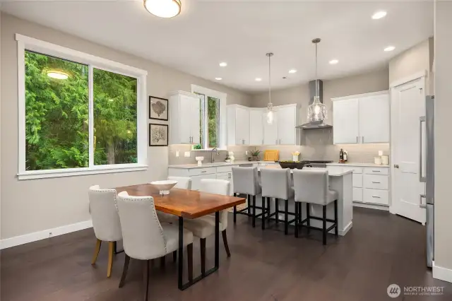 Looking from the living room to the kitchen with eat-in space.