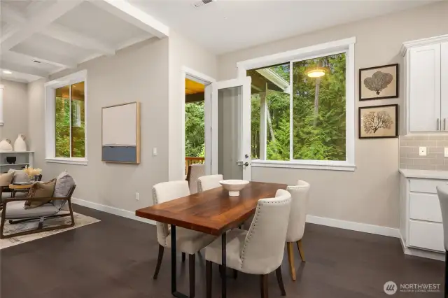 Eat-in dining space off the kitchen. Living room to the left, door to the amazing deck at center.