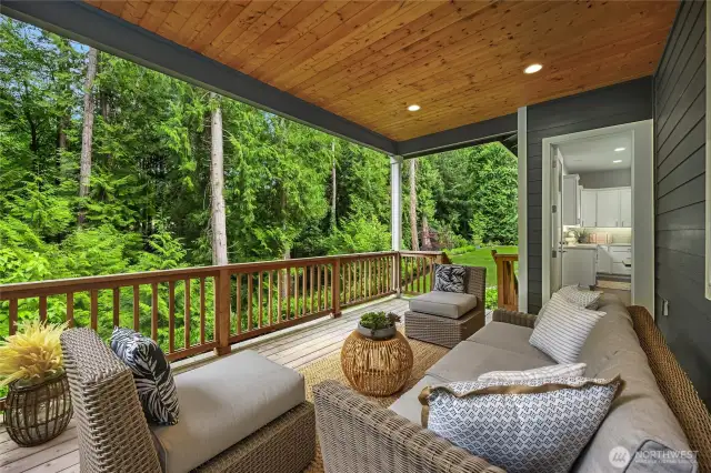 This is where you will want to spend all your time! Fully covered so you can enjoy this space even if there is a little drizzle. Steps lead to the yard.