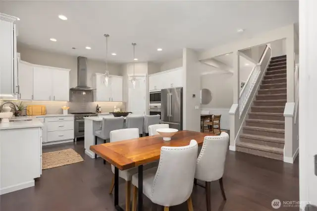 Stepping back into the house, kitchen to the left, stairs to the upper level.