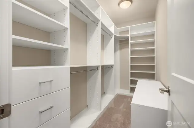 The large primary walk-in closet with built-ins.
