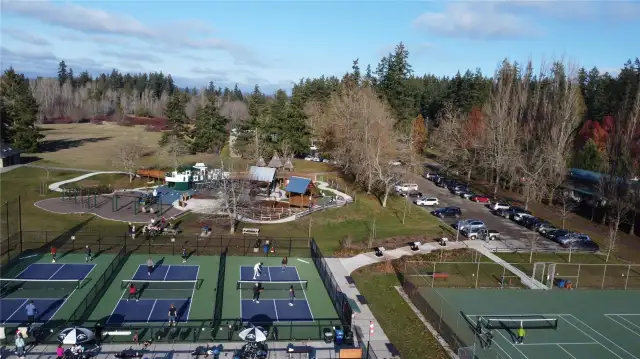 Battle Point Park with a lake, new playground, playing fields, an observatory, tennis and pickleball courts, bike park, fruit trees and ++++