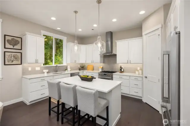 Beautifully appointed, the chef's kitchen has everything you need.