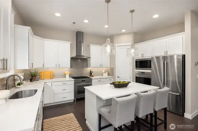 Quartz countertops, high end appliances and a great breakfast bar/island round out the kitchen.