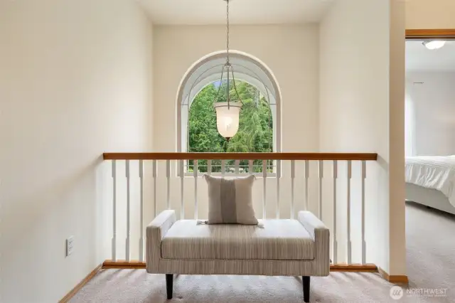 Second Floor balcony with huge decorative window and statement lighting.