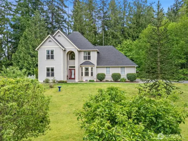 Lush natural surroundings and fruit trees.
