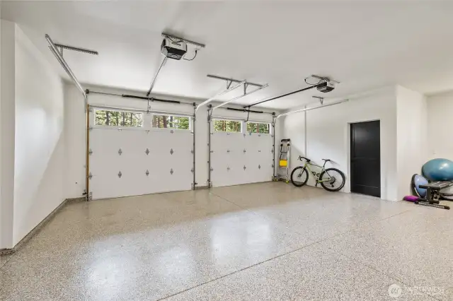 Garage with epoxy flooring.