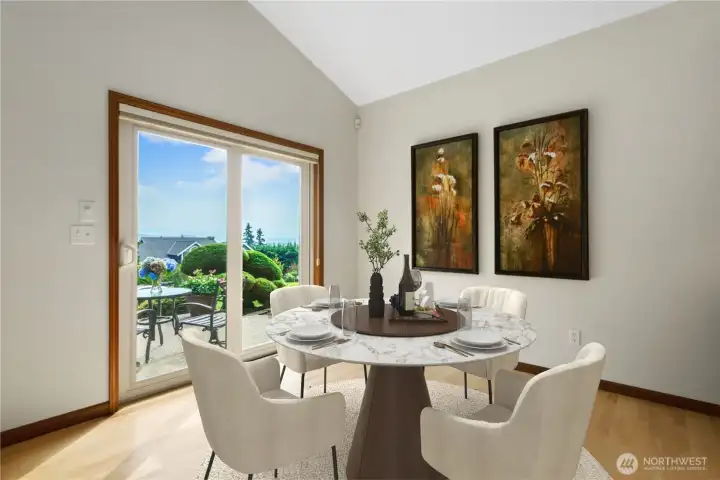 Casual eating nook with sliding glass doors to the patio.  This photo is virtually staged.