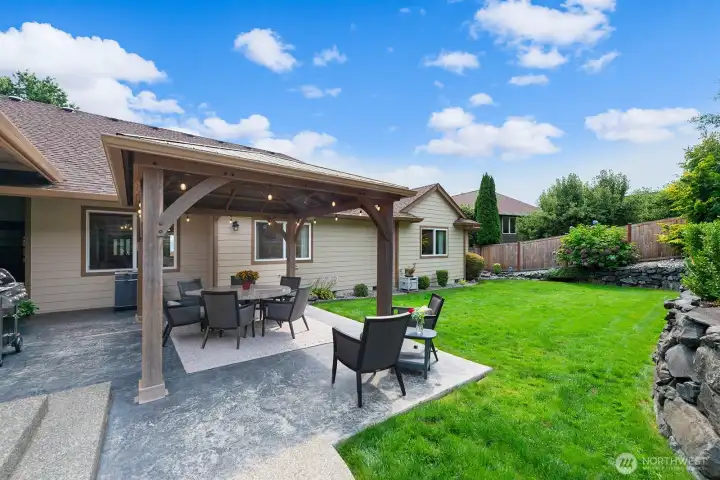 Covered outdoor patio with ceiling lights.
