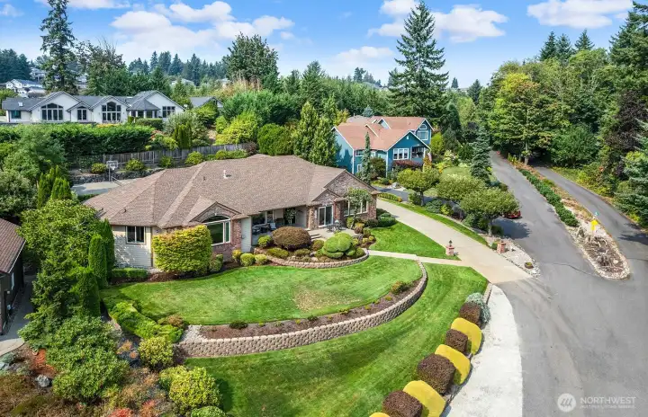 Magnificent park-like setting in the front and back yard.